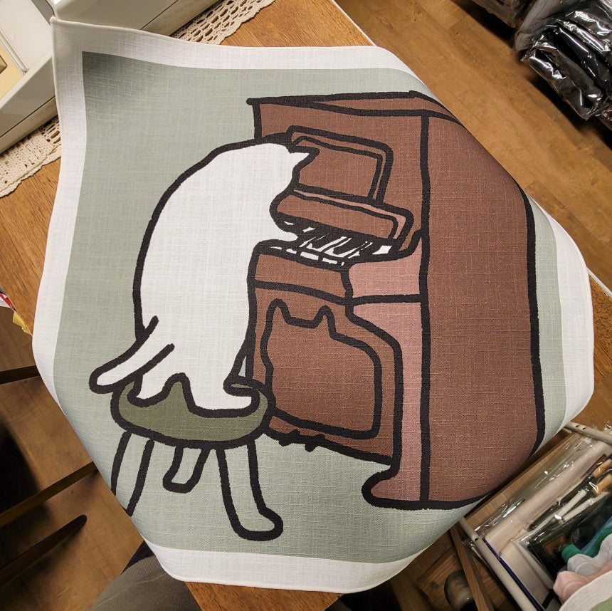 a cat playing the piano, fabric poster