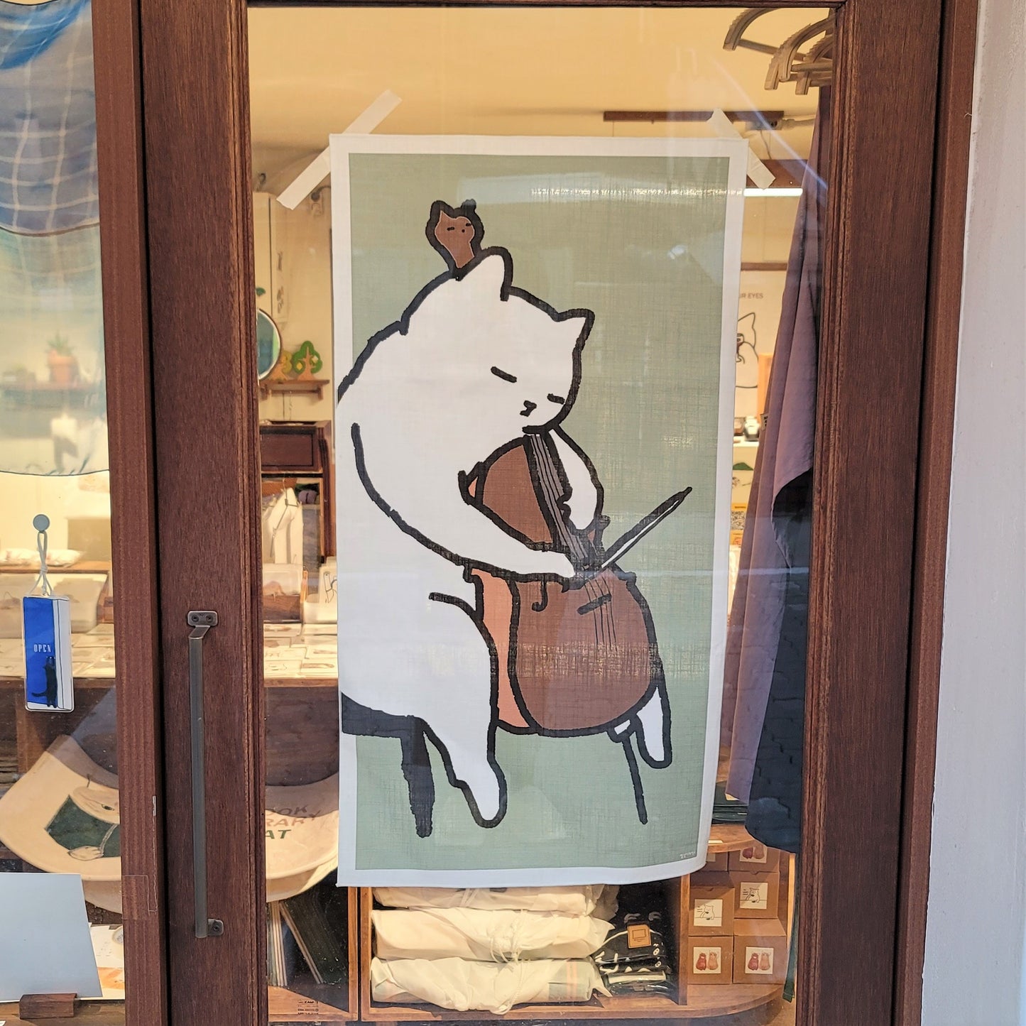 A cat playing the cello fabric poster (large size)