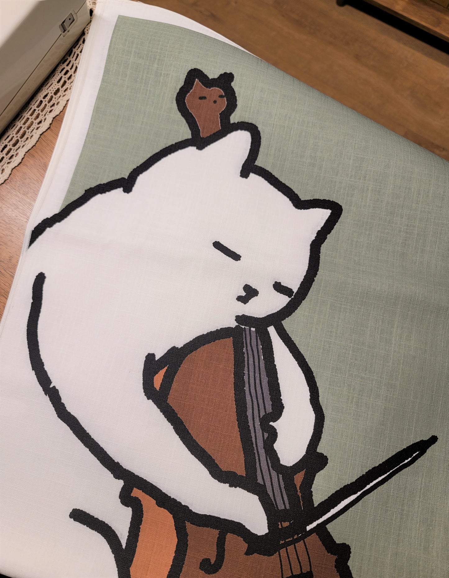 A cat playing the cello fabric poster (large size)