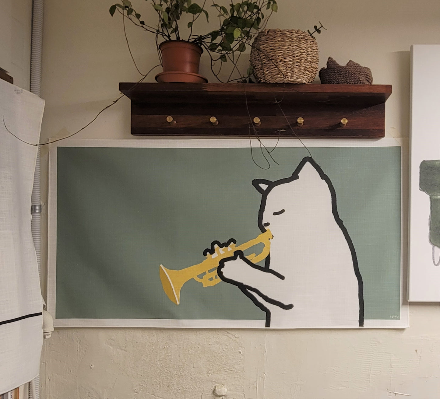 A cat playing the trumpet fabric poster