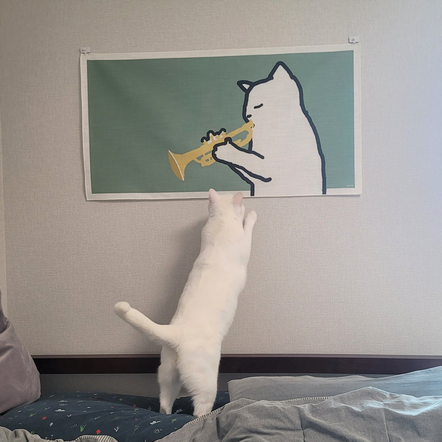 A cat playing the trumpet fabric poster