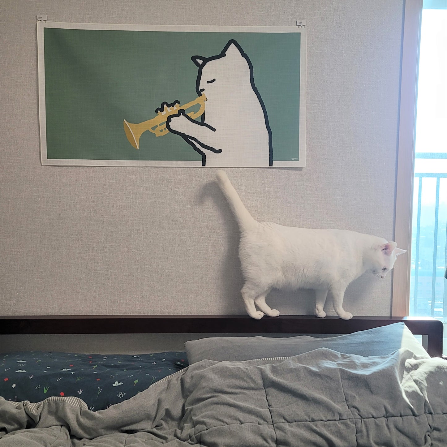 A cat playing the trumpet fabric poster