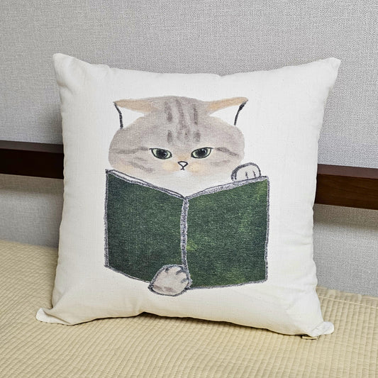 cat reading a book cushion cover